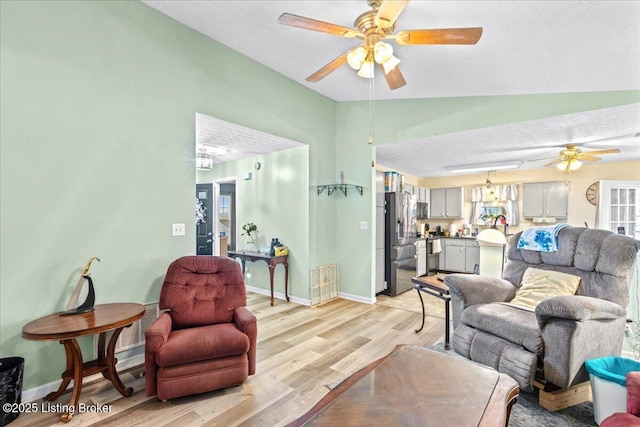1312 Cedar Springs Pkwy, La Grange, KY 40031 - living area with light wood finished floors, lofted ceiling, baseboards, and a ceiling fan