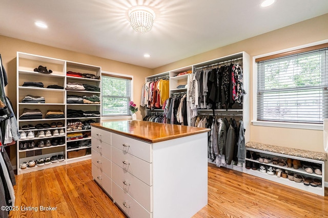 walk in closet featuring light wood finished floors