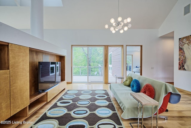 1301 S Buckeye Ln, Goshen, KY 40026 - living area with high vaulted ceiling, light wood-type flooring, and a chandelier