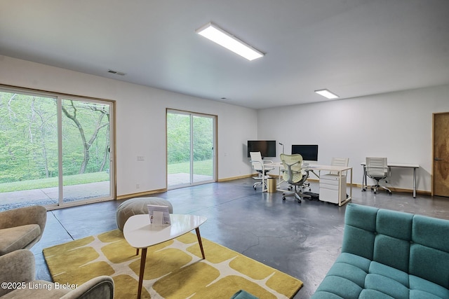 1301 S Buckeye Ln, Goshen, KY 40026 - living area with an office area, finished concrete flooring, and baseboards
