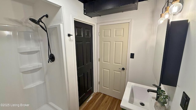 5013 Tolkien Ct, Louisville, KY 40229 - bathroom with a sink, walk in shower, and wood finished floors