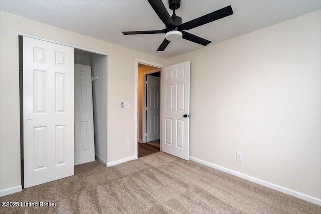 4804 Mike Ct, Louisville, KY 40291 - unfurnished bedroom with carpet flooring, baseboards, a ceiling fan, and a closet