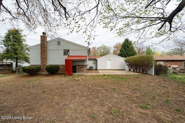 4804 Mike Ct, Louisville, KY 40291 - rear view of house with a patio, a chimney, and fence