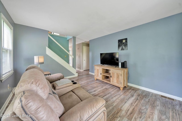 7110 Textile Ave, Louisville, KY 40258 - living area with stairs, wood finished floors, and baseboards