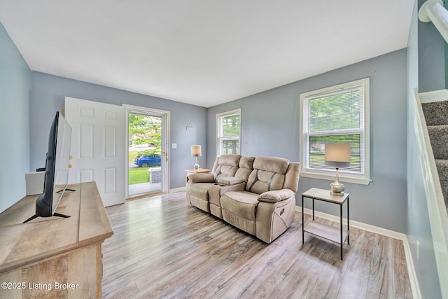 7110 Textile Ave, Louisville, KY 40258 - living area with light wood-style flooring, baseboards, and stairway