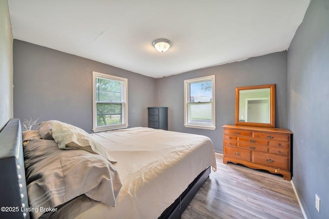 7110 Textile Ave, Louisville, KY 40258 - bedroom featuring light wood-type flooring and baseboards