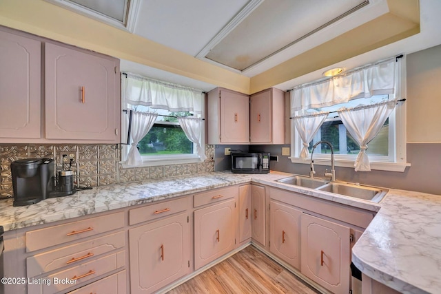 7110 Textile Ave, Louisville, KY 40258 - kitchen with a sink, black microwave, healthy amount of natural light, and light wood-style floors