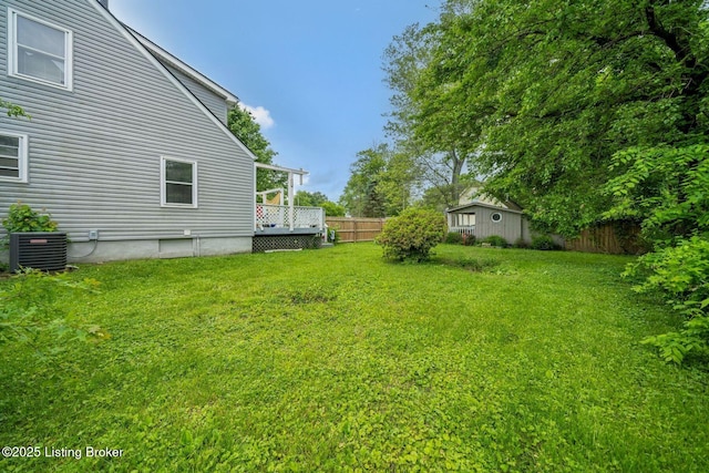 7110 Textile Ave, Louisville, KY 40258 - view of yard featuring central air condition unit, a deck, and an outdoor structure