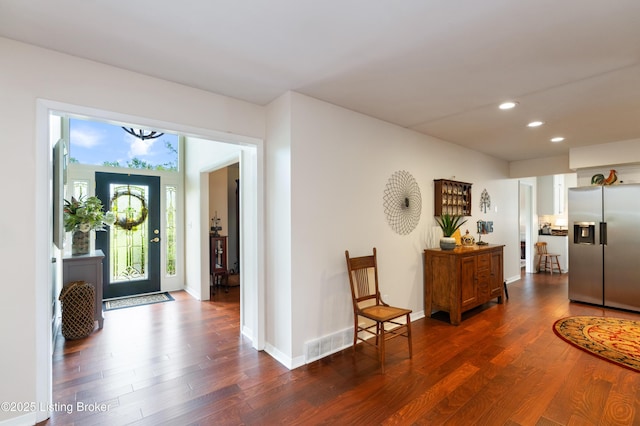 entrance foyer with recessed lighting, dark wood-style floors, and baseboards