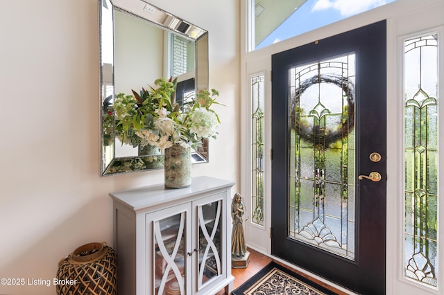 entryway with wood finished floors