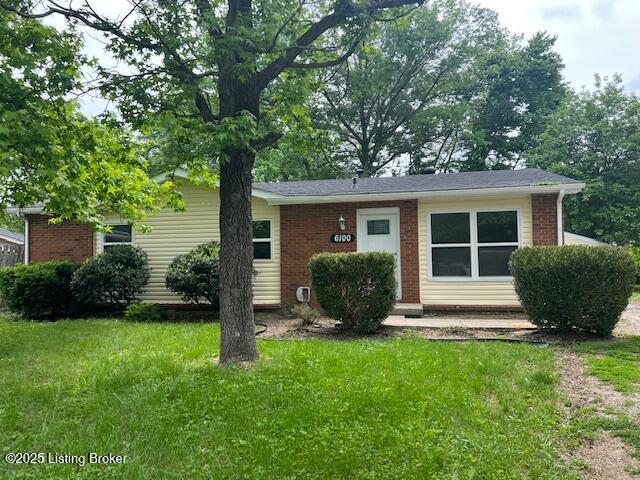 6100 Deady Dr, Louisville, KY 40258 - view of front of home with brick siding and a front lawn