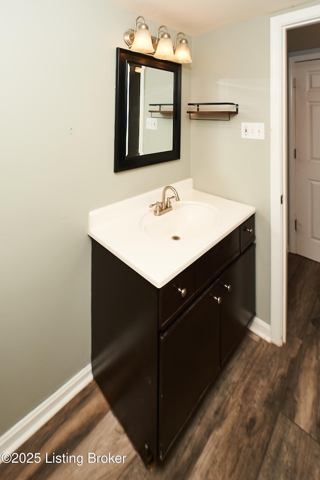 11529 N Tazwell Dr, Louisville, KY 40241 - bathroom featuring baseboards, wood finished floors, and vanity