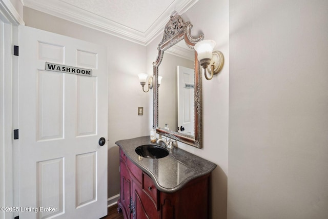 bathroom featuring crown molding and vanity