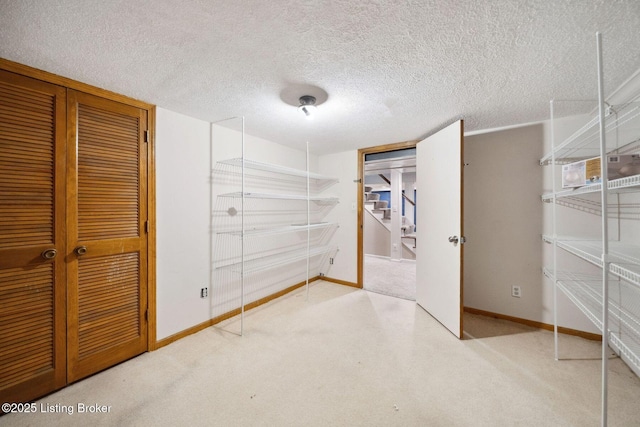 walk in closet with carpet floors