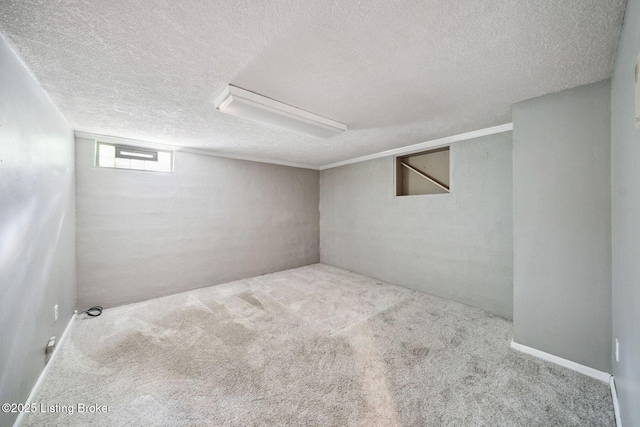 basement featuring carpet and a textured ceiling
