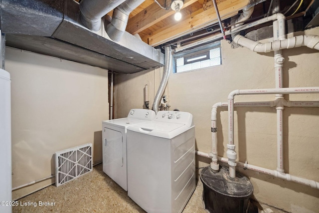 clothes washing area with independent washer and dryer