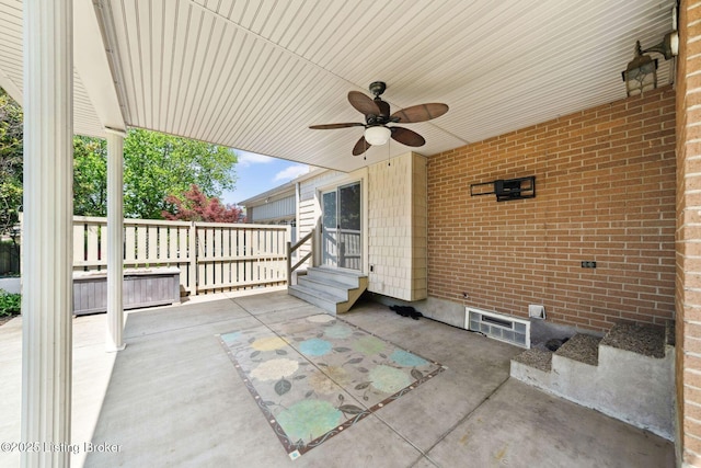 view of patio / terrace with entry steps and ceiling fan