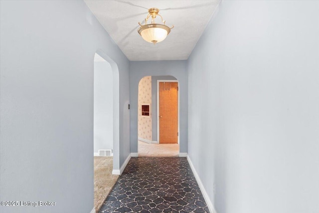 8004 Sherry Lynn Ct, Louisville, KY 40228 - hallway with arched walkways and baseboards