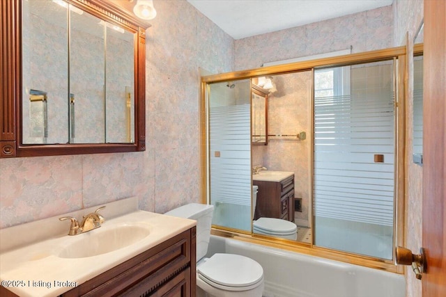 8004 Sherry Lynn Ct, Louisville, KY 40228 - full bathroom featuring wallpapered walls, toilet, vanity, and bath / shower combo with glass door