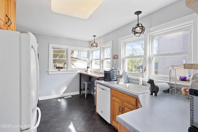 17 Denham Rd, Louisville, KY 40205 - kitchen featuring white appliances, a sink, light countertops, dark tile patterned floors, and baseboards