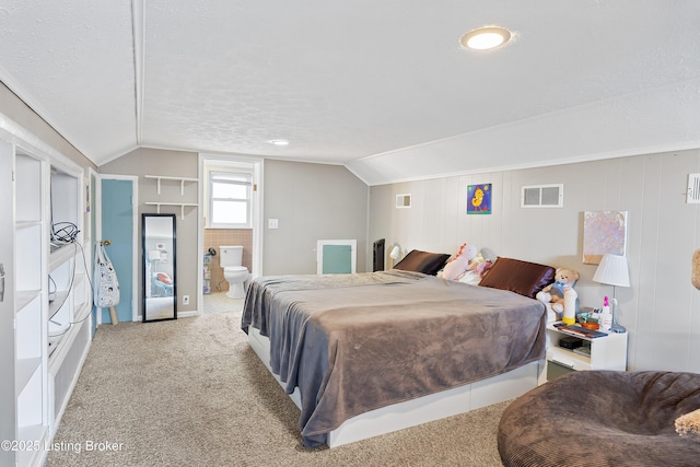 17 Denham Rd, Louisville, KY 40205 - bedroom with lofted ceiling, carpet floors, ensuite bathroom, and a textured ceiling