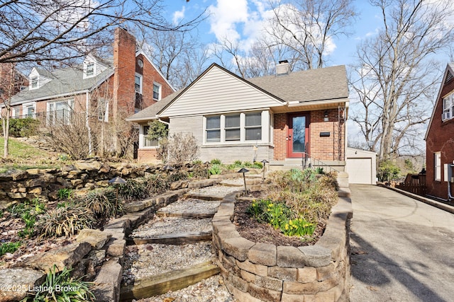 17 Denham Rd, Louisville, KY 40205 - bungalow-style home with brick siding, a chimney, a detached garage, and a shingled roof