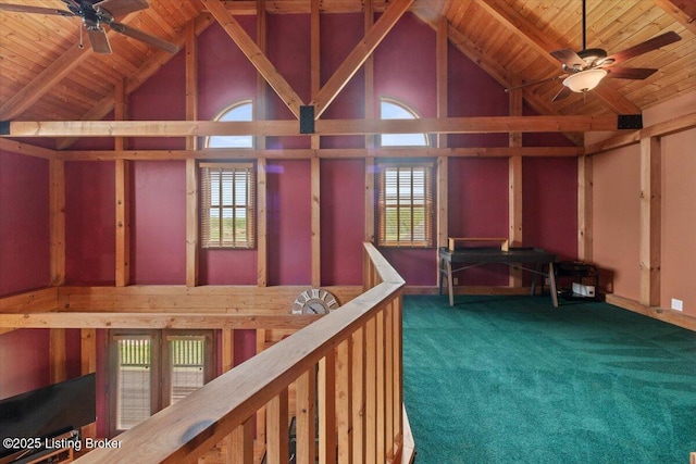 misc room featuring ceiling fan, high vaulted ceiling, wood ceiling, carpet floors, and beamed ceiling