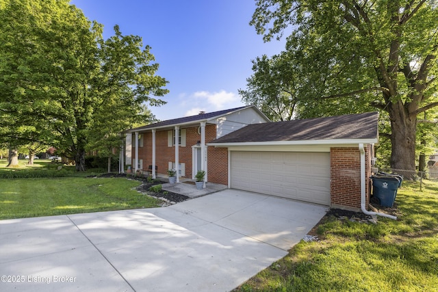greek revival house featuring brick siding, driveway, and an attached garage