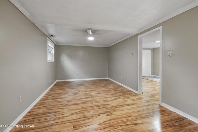 unfurnished room with light wood finished floors, crown molding, ceiling fan, and baseboards