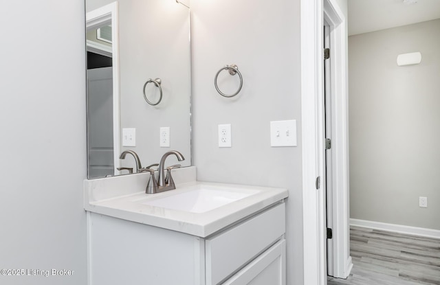 4612 Clayton Ter, Louisville, KY 40214 - bathroom featuring vanity, wood finished floors, and baseboards