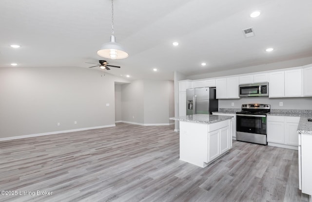 4612 Clayton Ter, Louisville, KY 40214 - kitchen with stainless steel appliances, a center island, light wood finished floors, white cabinets, and recessed lighting