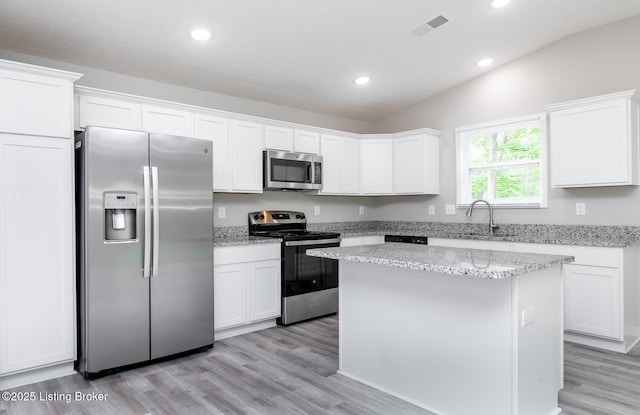 4612 Clayton Ter, Louisville, KY 40214 - kitchen with appliances with stainless steel finishes, a sink, light wood finished floors, white cabinets, and recessed lighting