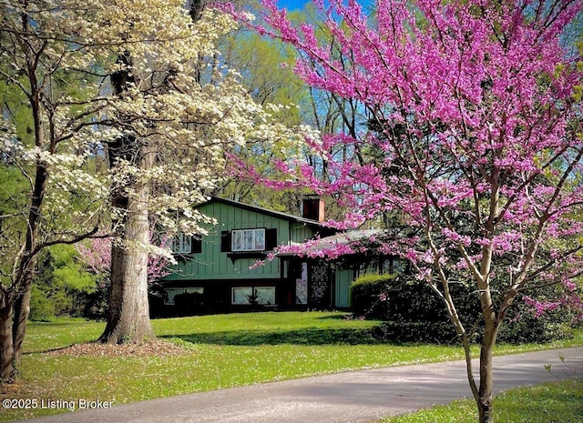 12715 Westport Rd, Louisville, KY 40245 - view of front of property with a front yard and board and batten siding