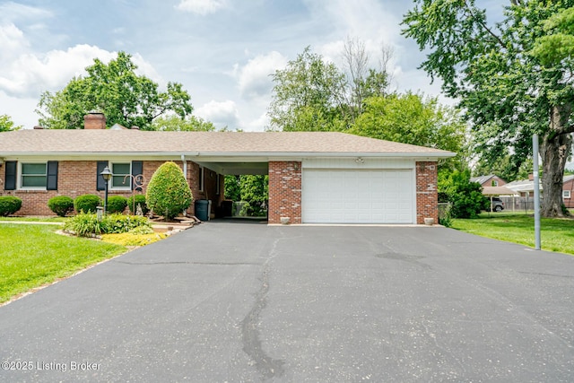 4305 Darbrook Rd, Louisville, KY 40207 - single story home with asphalt driveway, an attached garage, brick siding, and a front yard
