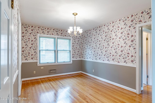 4305 Darbrook Rd, Louisville, KY 40207 - spare room featuring wallpapered walls, a chandelier, and light wood-style flooring