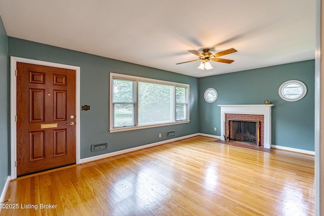 4305 Darbrook Rd, Louisville, KY 40207 - unfurnished living room featuring wood finished floors, a ceiling fan, and a fireplace
