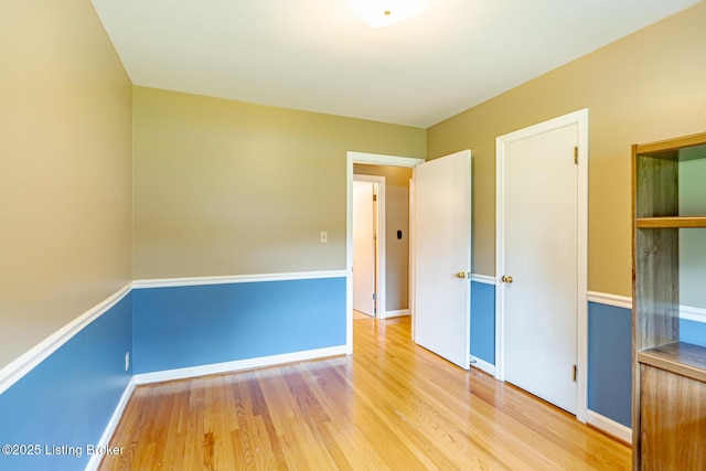 4305 Darbrook Rd, Louisville, KY 40207 - unfurnished bedroom featuring wood finished floors and baseboards