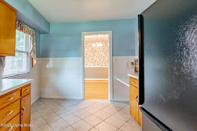 4305 Darbrook Rd, Louisville, KY 40207 - bathroom with tile patterned flooring, tile walls, vanity, a chandelier, and a wainscoted wall