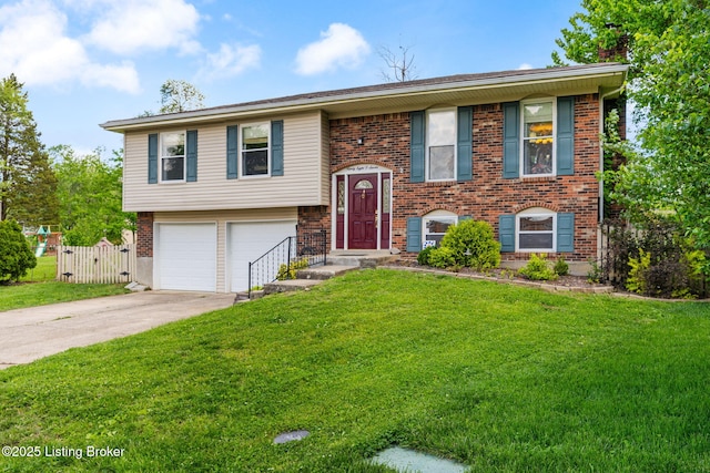 split foyer home featuring a garage, concrete driveway, and brick siding