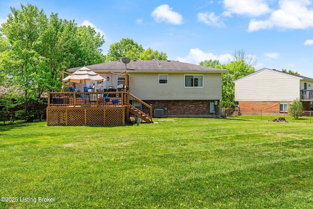 back of property with a wooden deck, central AC, stairway, and brick siding