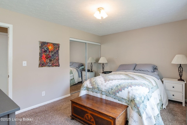 bedroom with carpet flooring, a closet, and baseboards