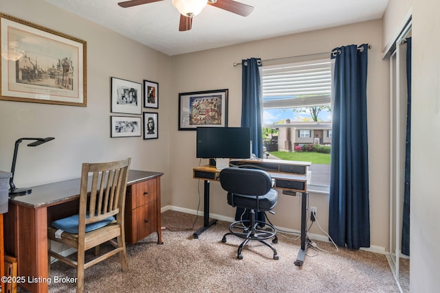 office area featuring ceiling fan, carpet floors, and baseboards