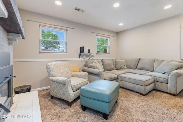 living area with recessed lighting, carpet flooring, and baseboards