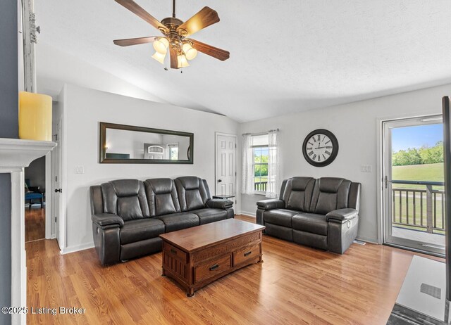 462 Wilsonville Rd, Fisherville, KY 40023 - living room featuring vaulted ceiling, light wood finished floors, a ceiling fan, and a fireplace