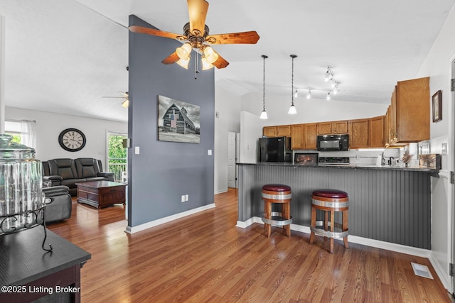 462 Wilsonville Rd, Fisherville, KY 40023 - kitchen with black appliances, a ceiling fan, open floor plan, lofted ceiling, and a peninsula