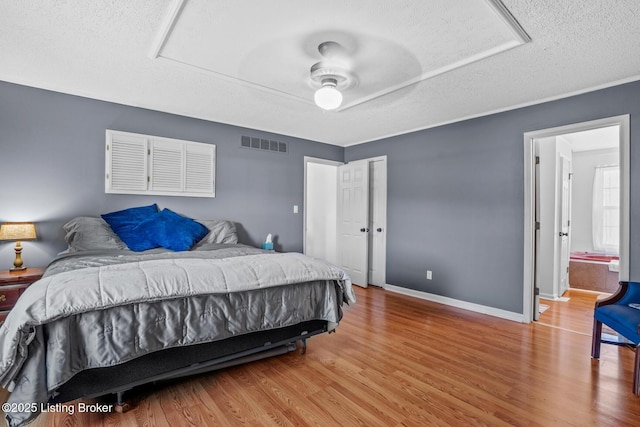 462 Wilsonville Rd, Fisherville, KY 40023 - bedroom with a textured ceiling, wood finished floors, and baseboards