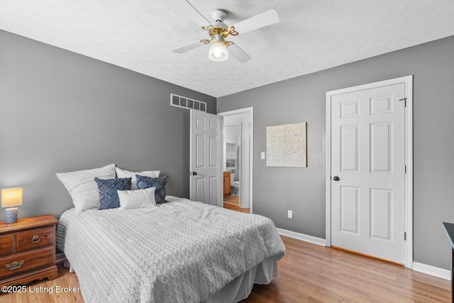 462 Wilsonville Rd, Fisherville, KY 40023 - bedroom with baseboards, wood finished floors, a textured ceiling, and a ceiling fan