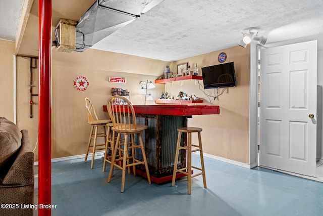 462 Wilsonville Rd, Fisherville, KY 40023 - indoor dry bar featuring concrete flooring, baseboards, and a textured ceiling