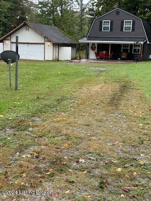 116 Spring Meadow Cir, Campbellsville, KY 42718 - view of green lawn with a detached garage and an outbuilding