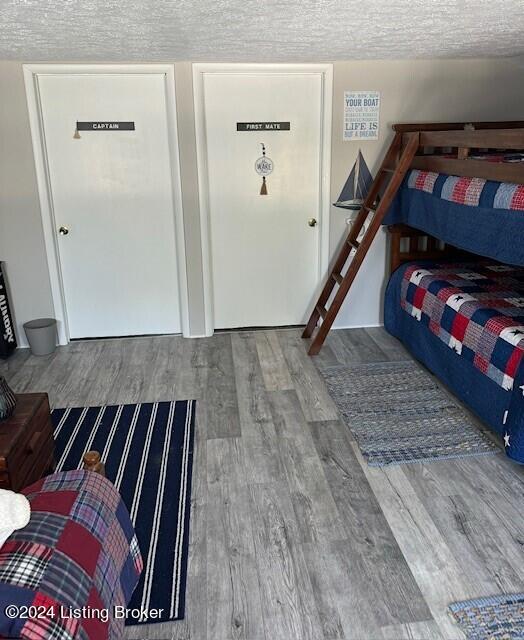 116 Spring Meadow Cir, Campbellsville, KY 42718 - bedroom with wood finished floors and a textured ceiling